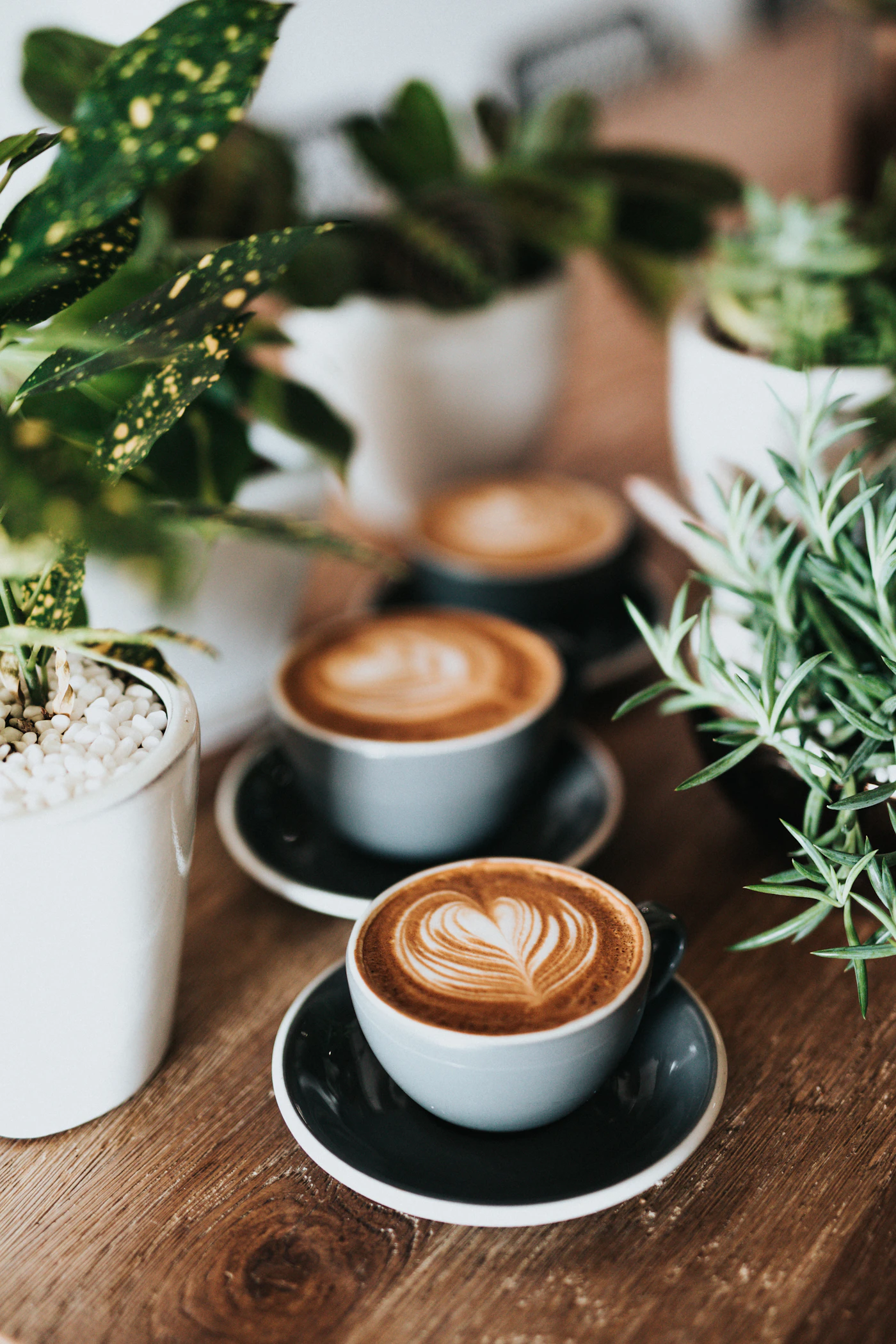 Illustrative coffee cup with latte art on a wooden table