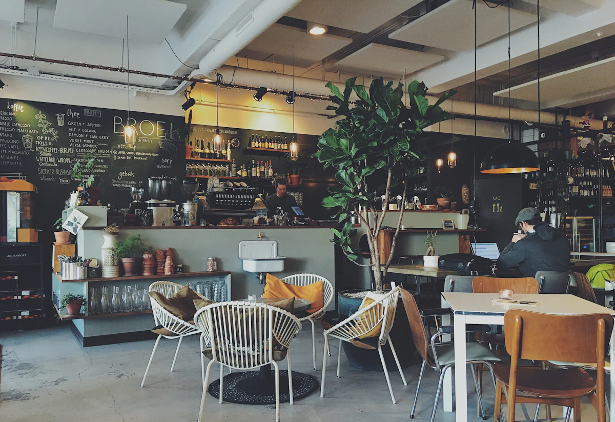 Illustrative café interior with seating and a coffee counter