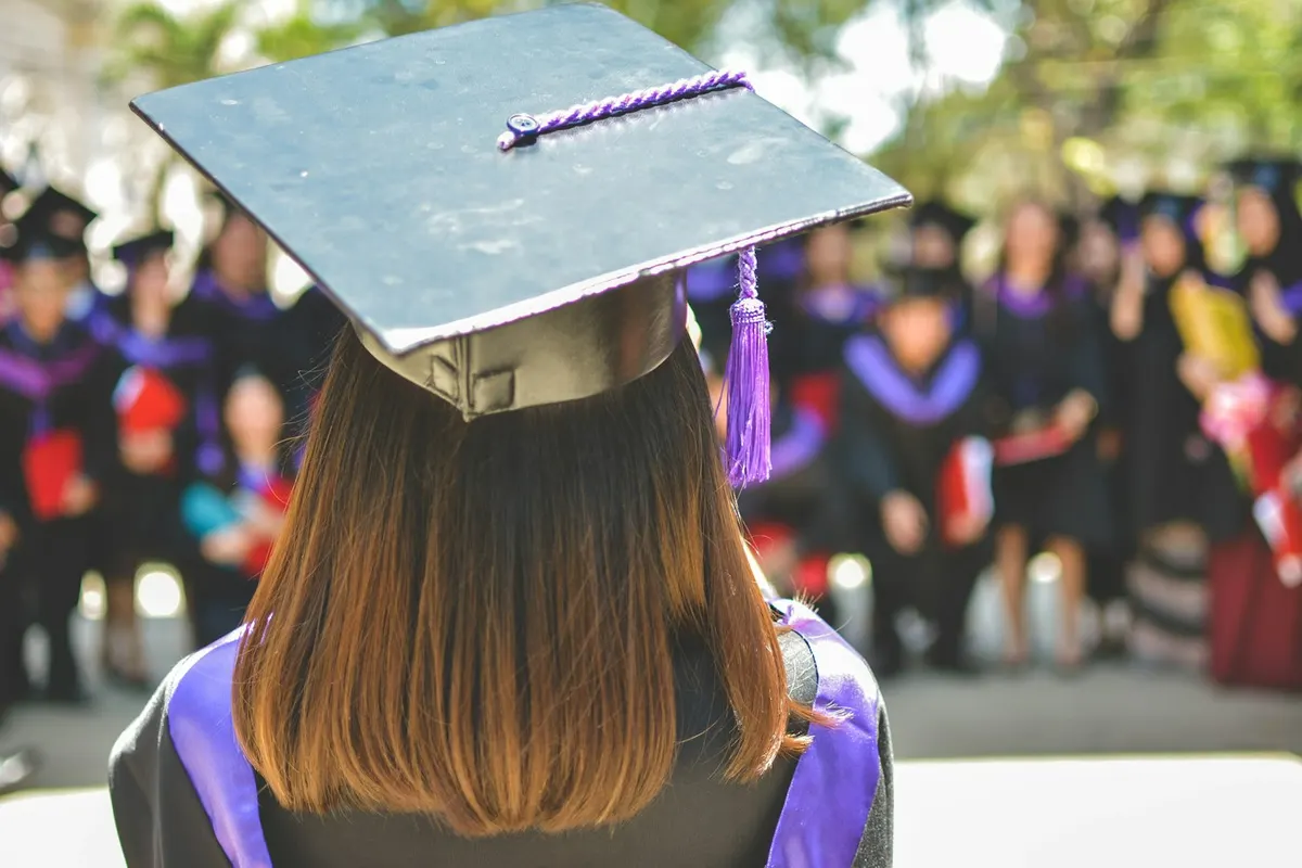 Illustrative graduate at a graduation ceremony